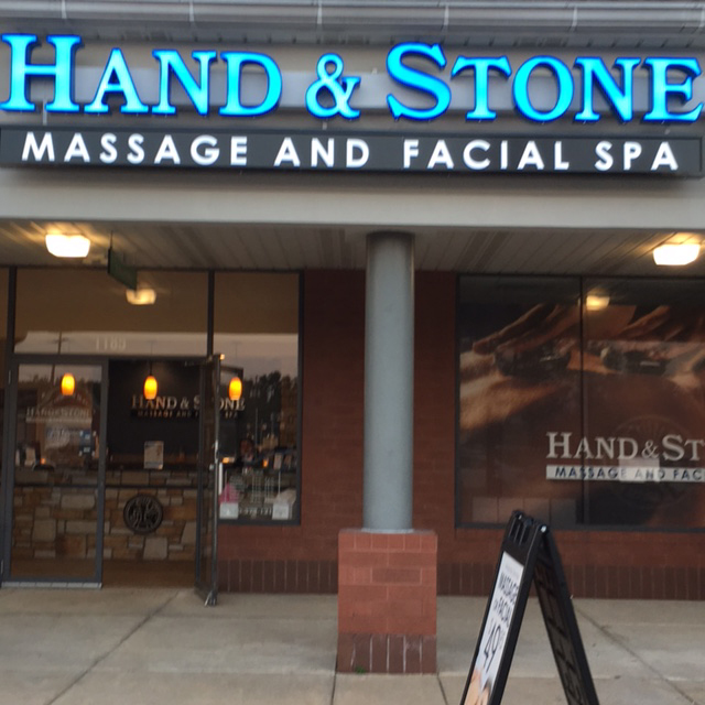 Hand and Stone store sign